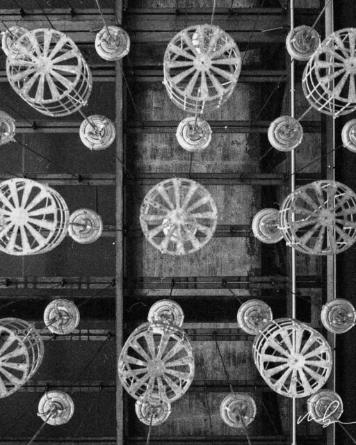 In historic coal mines, workers stored their clothes in suspended metal lockers to keep them safe underground. Photographed from below on analog film, these structures become a study of history, labor, and industrial design.

📷 Hasselblad 500CM 🎞 Ilford Delta 400 expired 2006